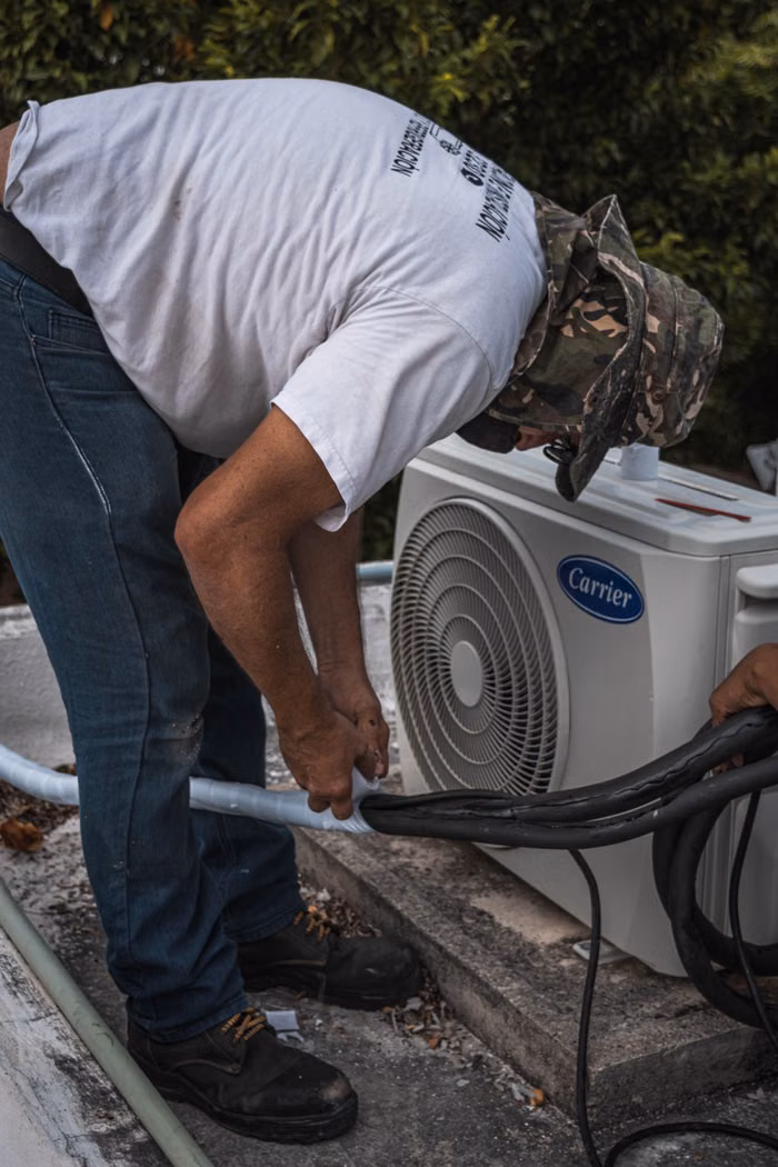 Outdoor unit servicing on rooftop